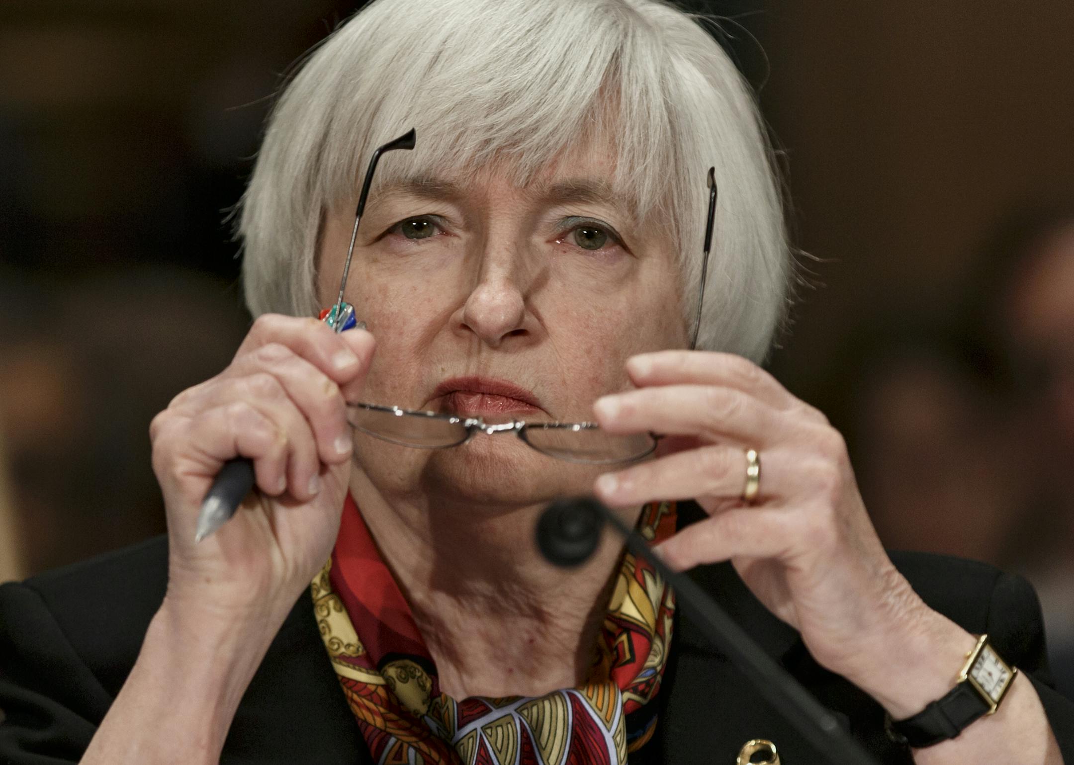 Federal Reserve Chair Janet Yellen listens on Capitol Hill in Washington, Thursday, Feb. 27, 2014, as she testifies before the Senate Banking Committee to deliver the semiannual Monetary Policy Report to Congress. Yellen noted that some recent economic data have pointed to weaker-than-expected gains in consumer spending and job growth. She said the Fed will be watching to see whether the slowdown proves only a temporary blip caused by severe winter weather. (AP Photo/J. Scott Applewhite)