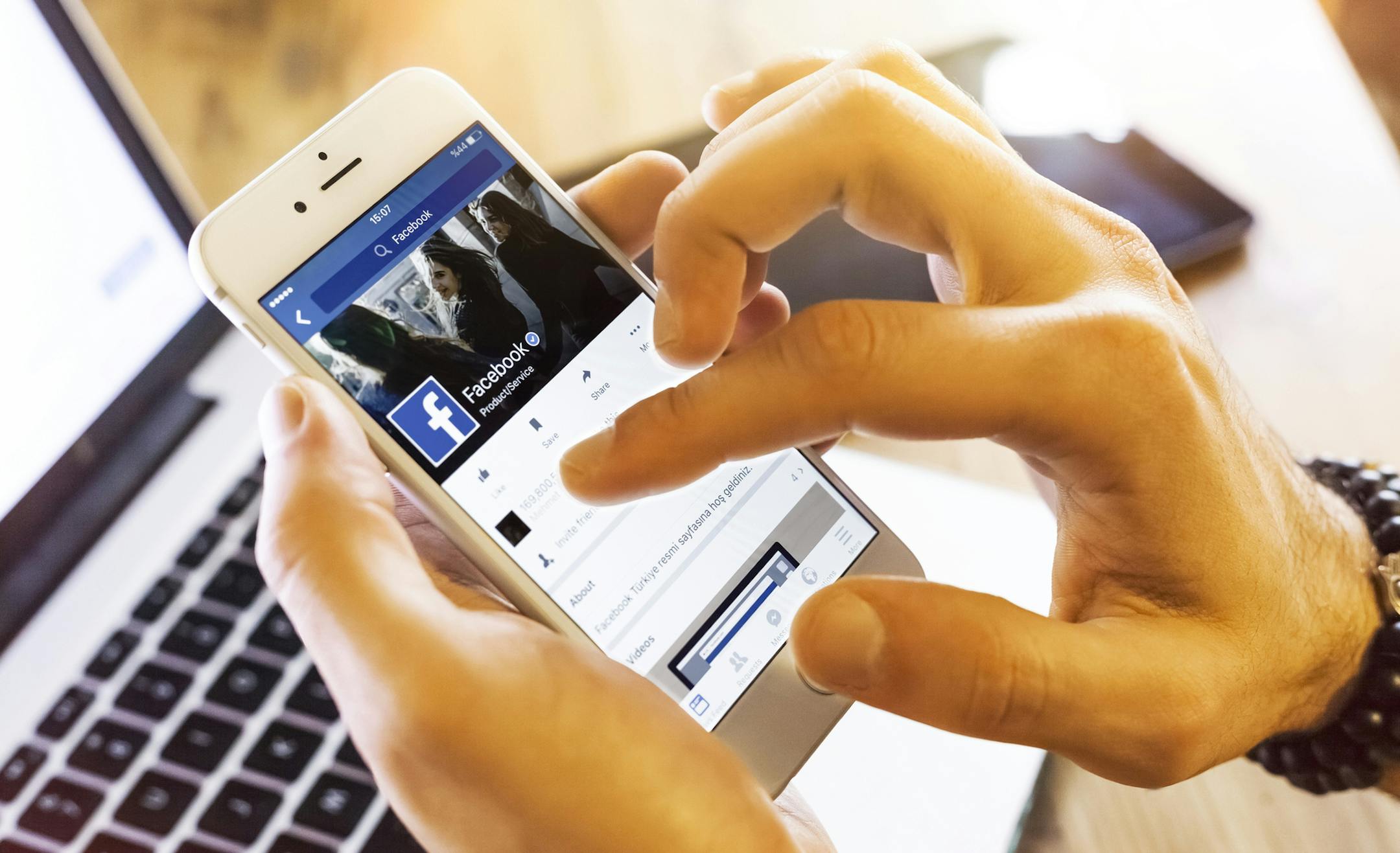 Istanbul, Turkey - January 13, 2016: Person holding a brand new Apple iPhone 6s with Facebook profile on the screen. Facebook is a social media online service for microblogging and networking, founded in February 4, 2004.. istock
