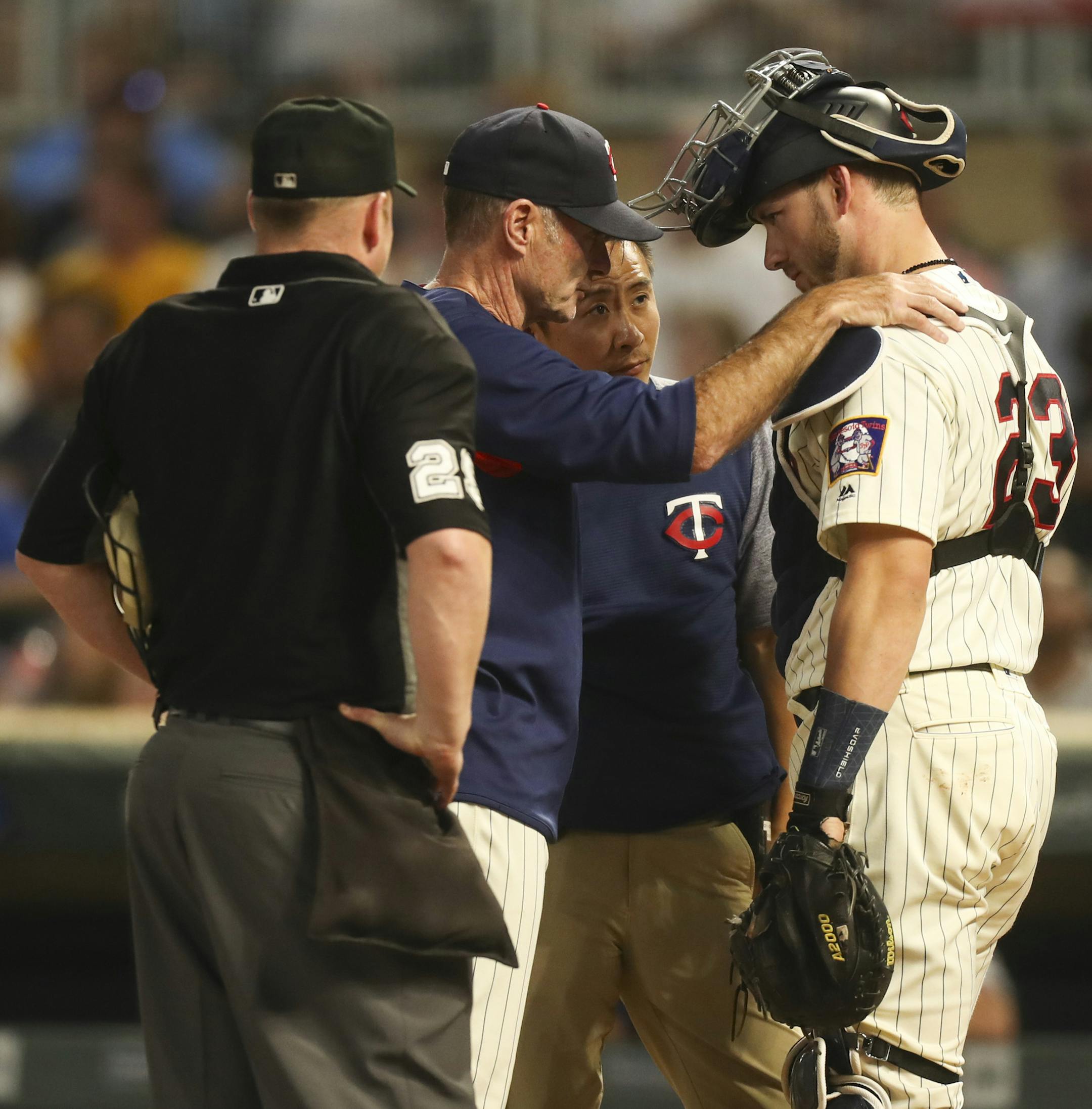 Minnesota Twins catcher Mitch Garver (23) spoke with manager Paul Molitor and a trainer after being hit by a foul ball in the second inning. He left the game after the inning was completed. ] JEFF WHEELER &#xef; jeff.wheeler@startribune.com The Twins faced the New York Yankees in an MLB baseball game Wednesday night, September 12, 2018 at Target Field in Minneapolis.