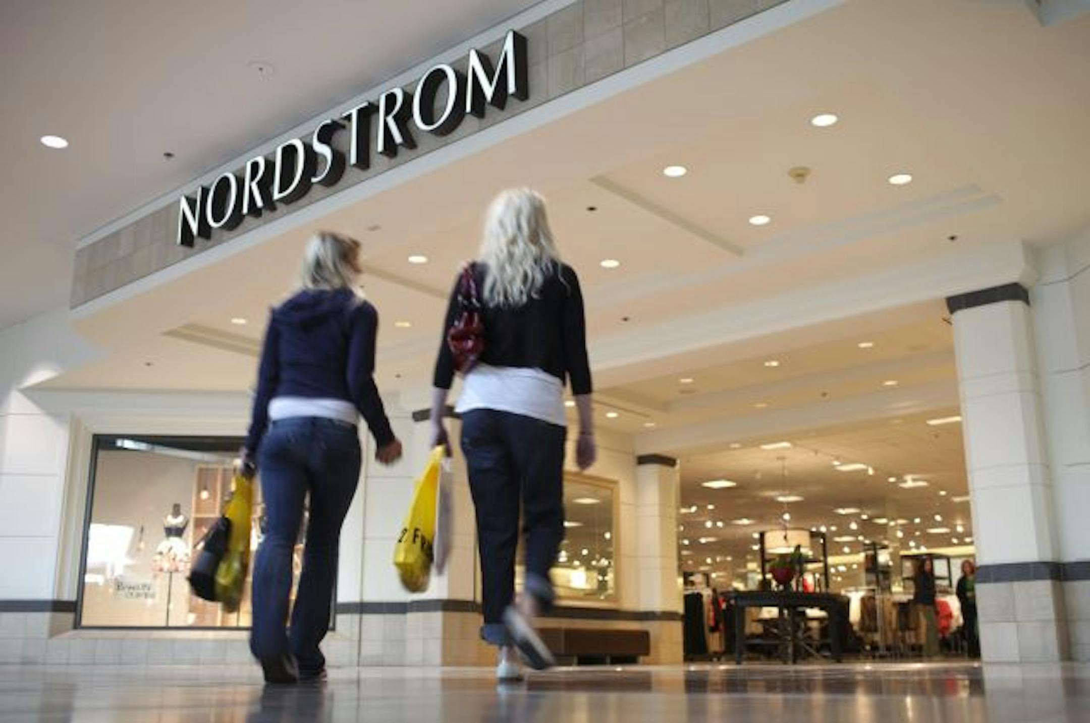 Shoppers showed signs of "upscaling," or returning to stores they frequented before the recession began, analysts said. Shoppers at the Mall of America on Thursday headed toward Nordstrom, which posted a whopping 10.3 percent increase in February sales over last year.