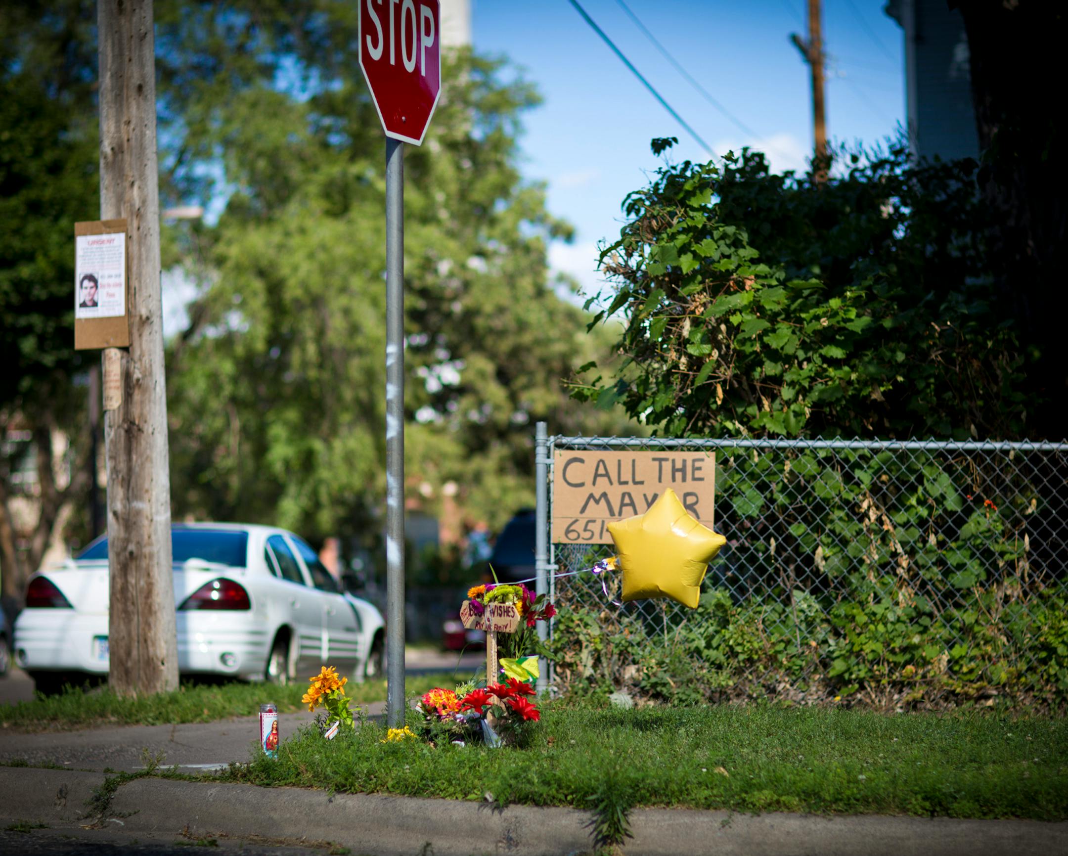 A memorial was set up in the area of the Payne Phalen neighborhood where a brutal beating left a man with brain damage last week of St. Paul, Minn. photographed on Tuesday, August 12, 2013. ] (RENEE JONES SCHNEIDER • reneejones@startribune.com)