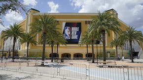 An NBA sign is posted on a basketball arena at ESPN Wide World of Sports Complex Wednesday, July 29, 2020, in Orlando, Fla. NBA games will resume Thur