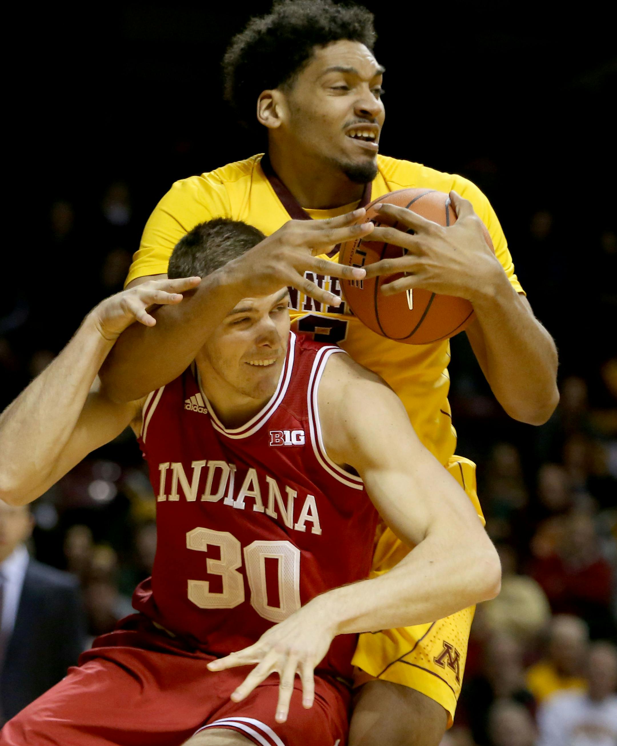 The University of Minnesota's Jordan Murphy (3) pulls down a defensive rebound over the University of Indiana's Collin Hartman (30) during the first half Saturday, Jan. 16, 2916, at Williams Arena in Minneapolis, MN. ](DAVID JOLES/STARTRIBUNE)djoles@startribune.com the University of Indiana versus the University of Minnesota**Jordan Murphy,Collin Hartman,cq