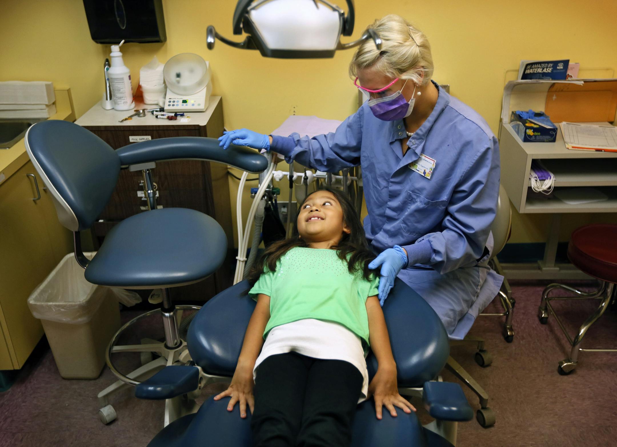 8-year-old Chelsea Velasquez waited for a new filling from Dr. Emily Eggebrecht at Children’s Dental Services in Minneapolis.