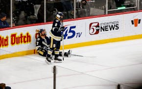 Chanhassen captain Jake Risch (8) and teammate Andy Earl dealt with it when Edina won the Class 2A championship game.