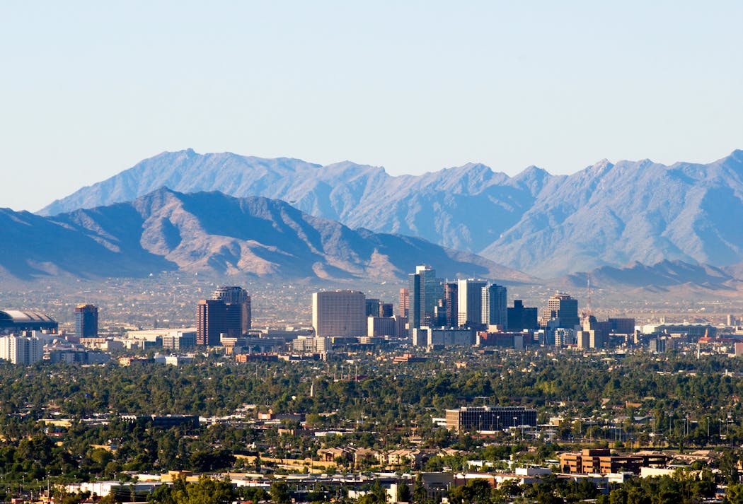 Downtown Phoenix with the South and Sierra Estrella mountain ranges.