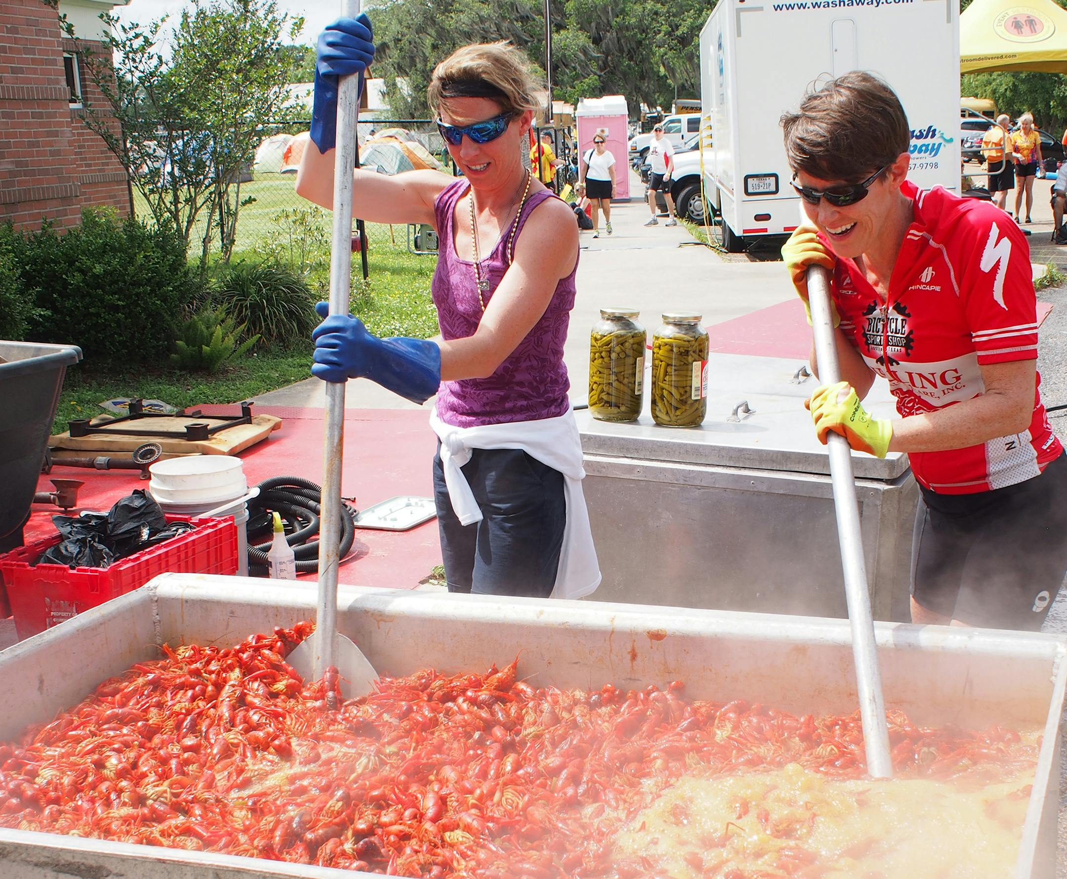Gretchen Sanders and Pam LeBlanc went from spectators to helpers, cooking up a batch of crawfish during Cycle Zydeco.