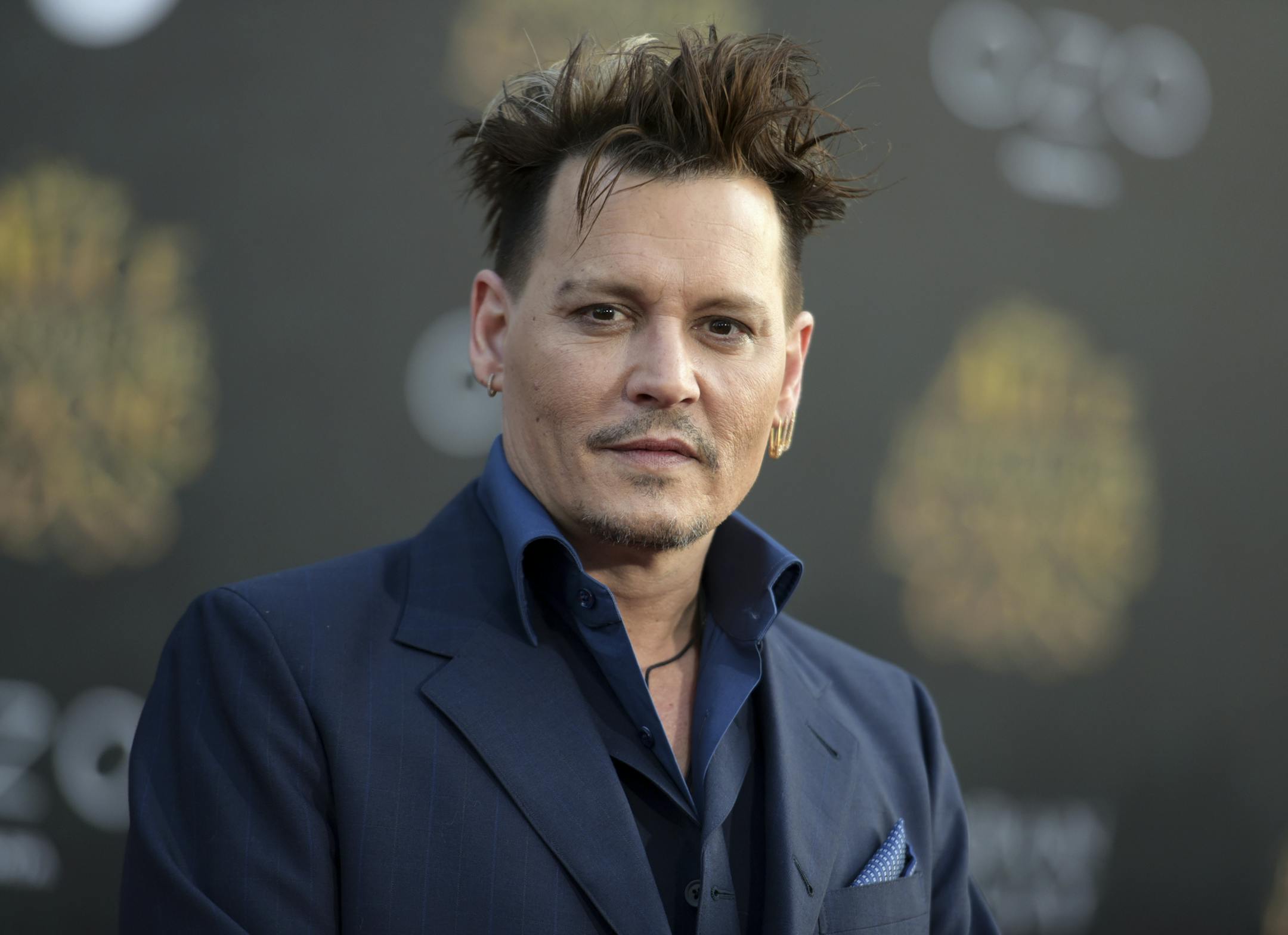 FILE - In this May 23, 2016 file photo, Johnny Depp arrives at the premiere of "Alice Through the Looking Glass" at the El Capitan Theatre, in Los Angeles.