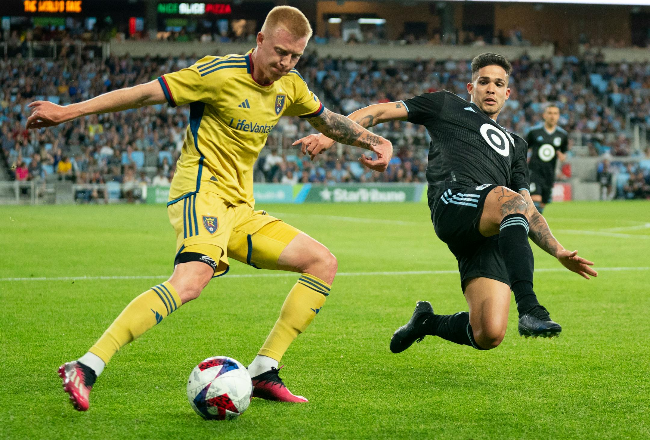 Real Salt Lake defender Justen Glad (15) clears the ball past Minnesota United forward Luis Amarilla (9) in the second half.