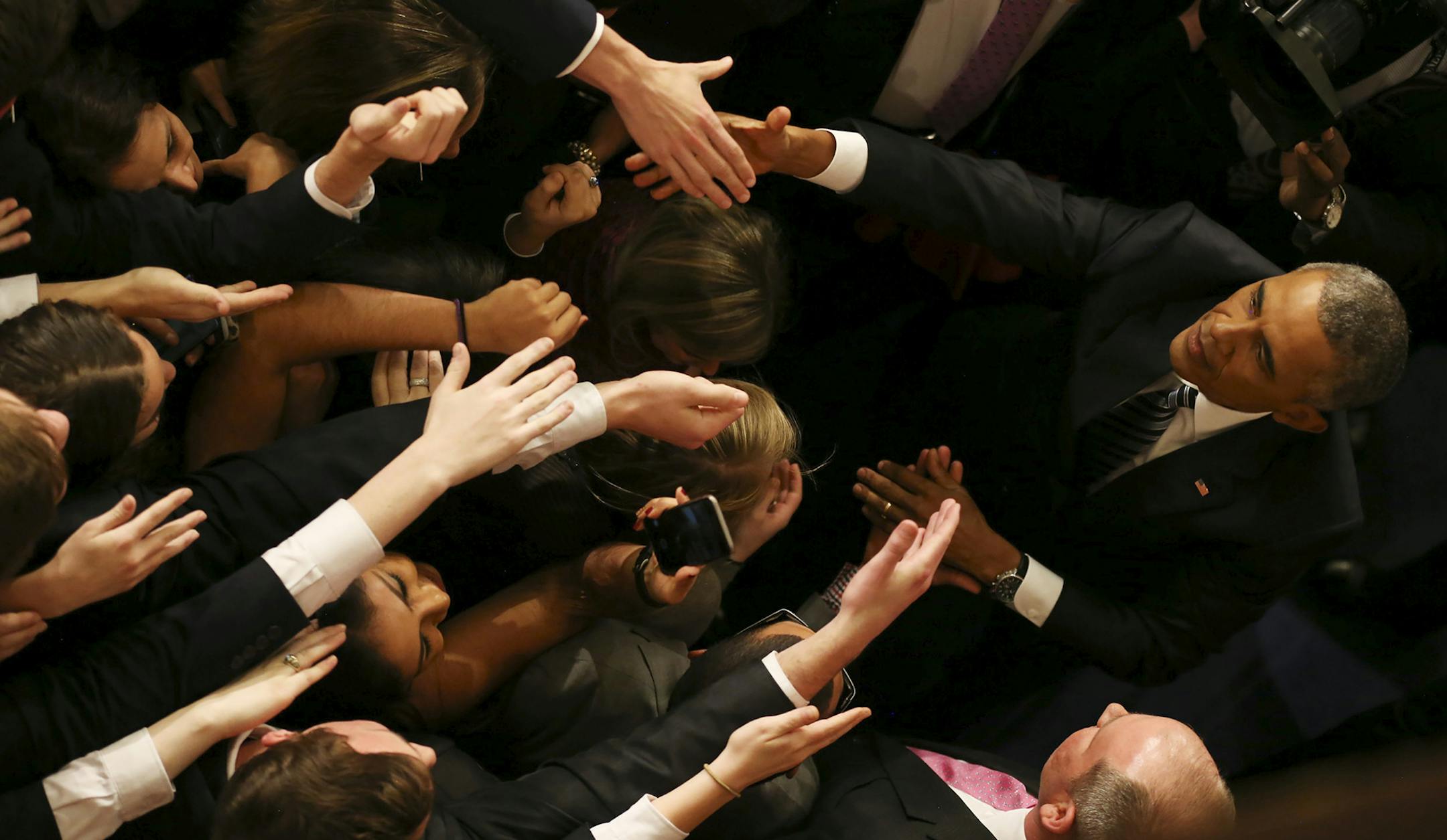 Lawmakers reach out to shake hands with President Barack Obama after his final State of the Union address, at the U.S. Capitol in Washington, Jan. 12, 2016. (Doug Mills/The New York Times) ORG XMIT: MIN2016011309451221