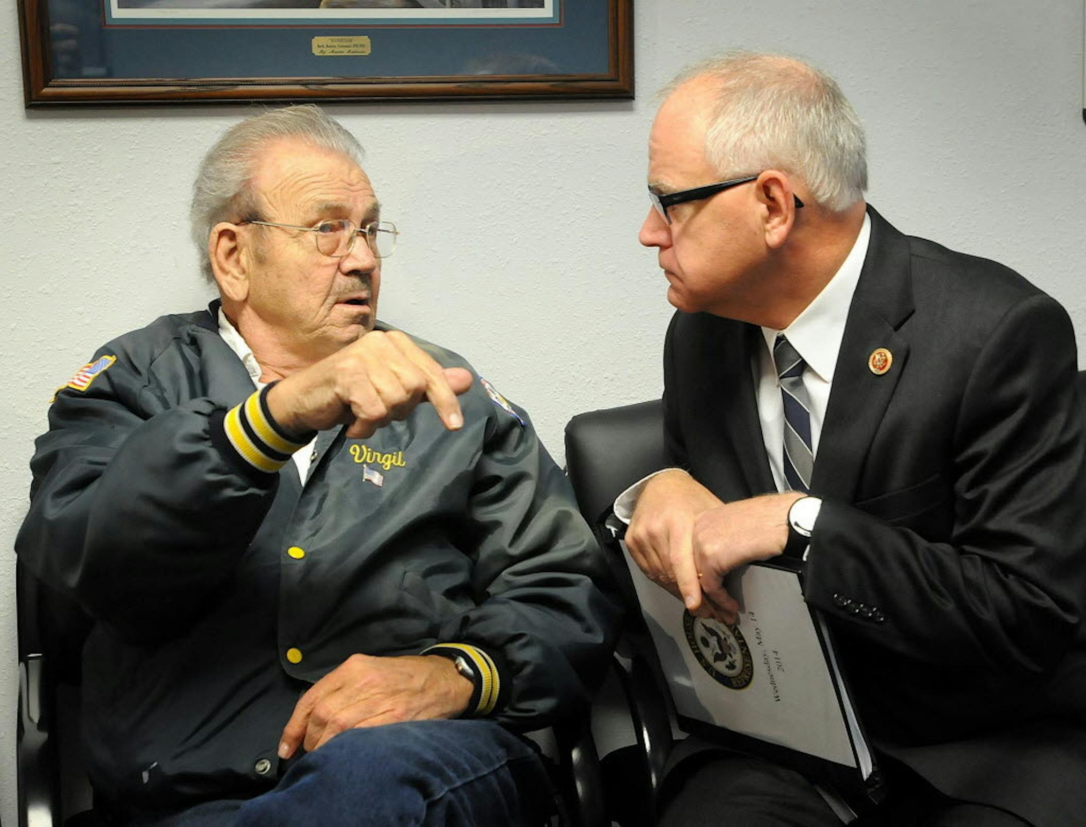U.S. Rep. Tim Walz visits with veteran Virgil Marble, left, during a visit to the Mankato VA Outpatient Clinic in Mankato, Minn., on Wednesday, May 14, 2013.