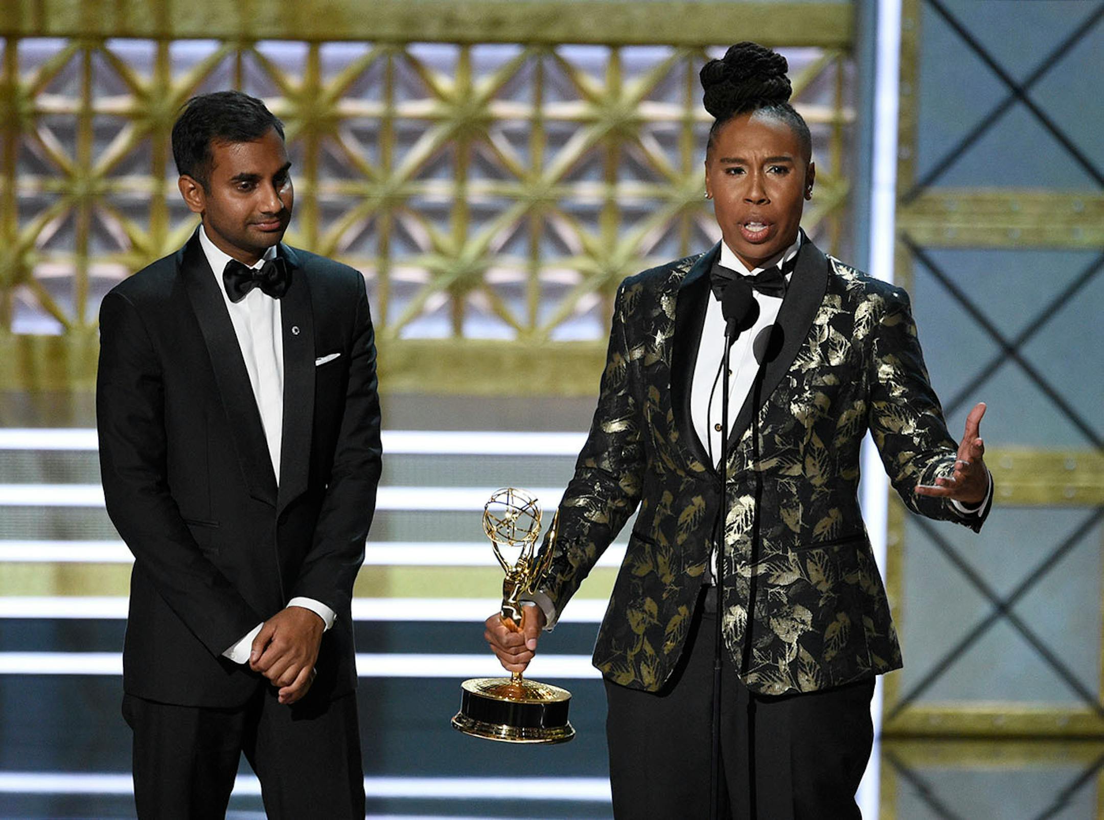 Aziz Ansari, left, and Lena Waithe accept the award for outstanding writing for a comedy series for the "Master of None" episode "Thanksgiving" at the 69th Primetime Emmy Awards on Sunday, Sept. 17, 2017, at the Microsoft Theater in Los Angeles.