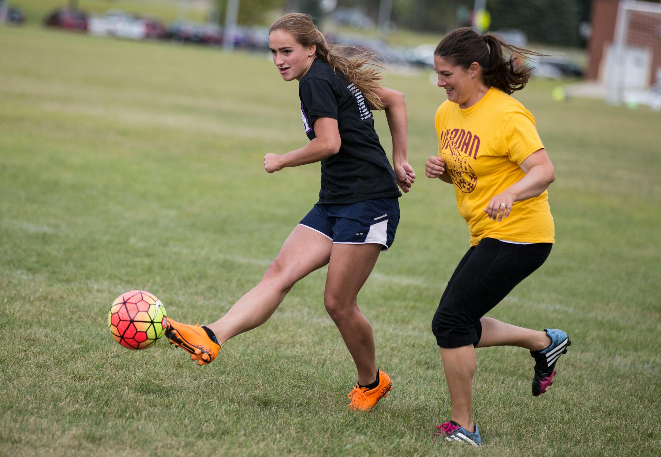 Rylee Whiteside, left, practices with varsity girls soccer coach Janae Vogel at Jordan High School. The 2015 season is the first that Jordan will field both boys and girls varsity soccer. (LEILA NAVIDI, Star Tribune )