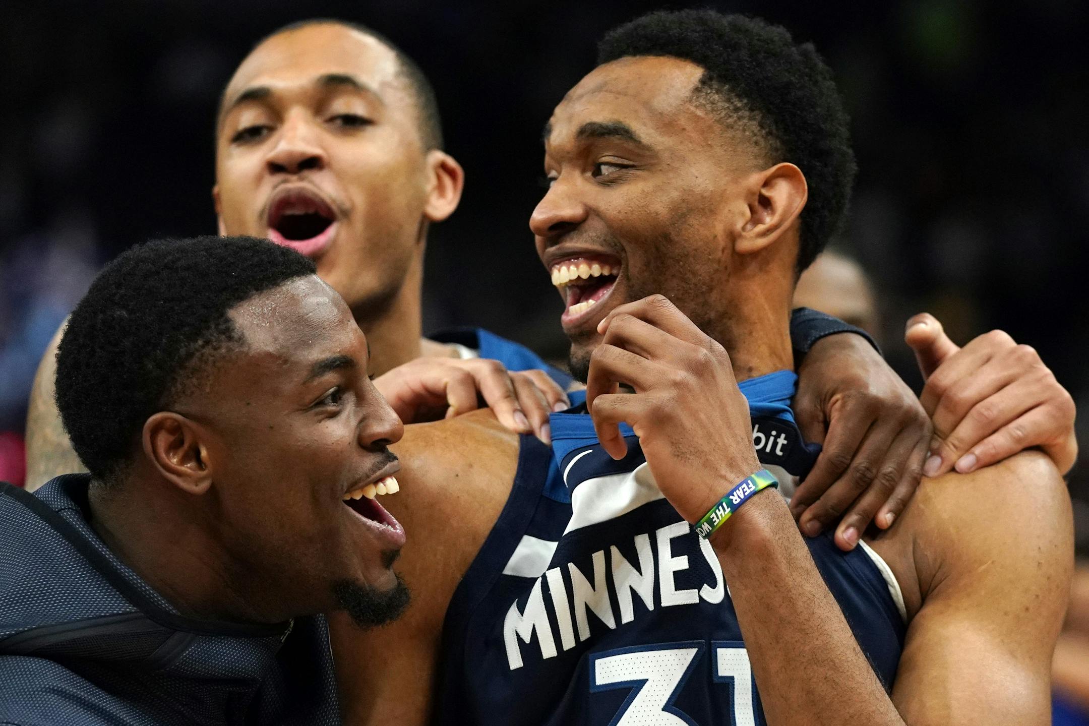 Keita Bates-Diop celebrated with Timberwolves teammates after a game in March at Target Center.