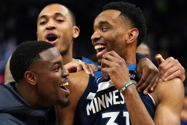Keita Bates-Diop celebrated with Timberwolves teammates after a game in March at Target Center.