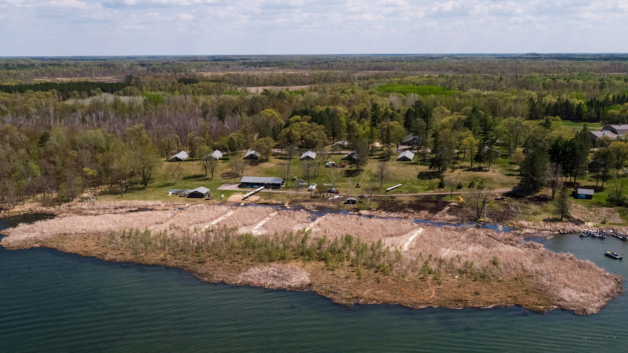 Volunteers attempted by land and lake to remove a large bog that terrorized north Long Lake last fall and grounded on the beach at Legionville, preventing the beach from being used for boating and swimming. The attempted removal was photographed Wednesday, May 16, 2018. ] AARON LAVINSKY &#xef; aaron.lavinsky@startribune.com