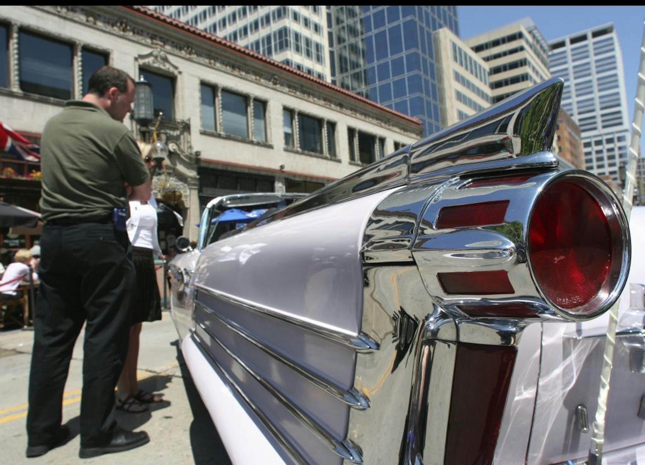 Displaying the classic '50's style, this 1958 Oldsmobile Super 88 convertible owned by Jerry Felde, featured big fins and lots of chrome. GENERAL INFORMATION: Duane Braley/Star Tribune--Minneapolis, Mn., Thurs., June 16, 2005--Strollers on the Mall past Peavey Plaza from 11 AM to 1:30PM were treated to a sample of what they will see if they go the State Fairgrounds this weekend for the Minnesota Street Rod Association's "Back to the 50's" show. Running from Friday through Sunday the event will f