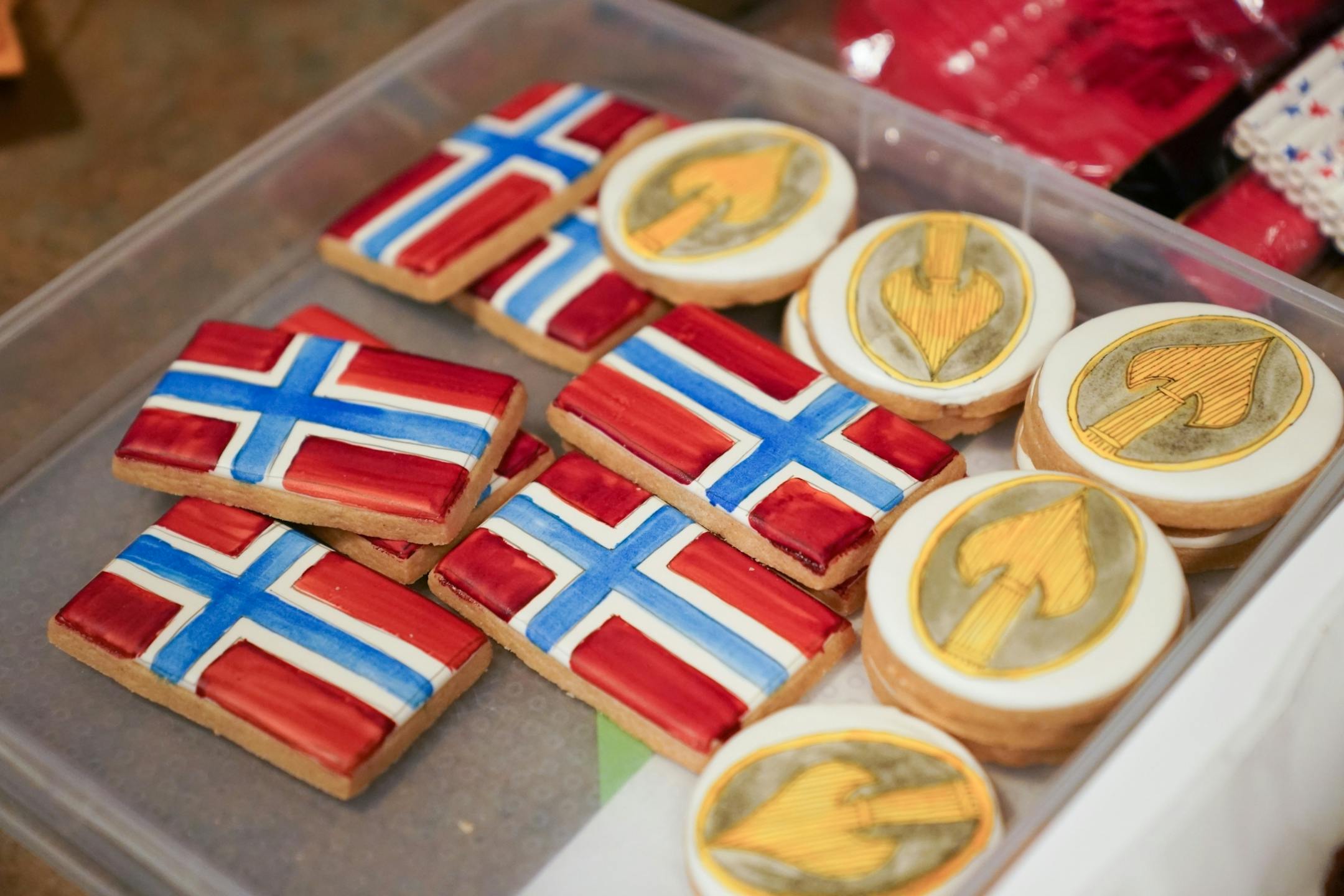 A relative brought cookies with the Norwegian flag and OSS insignia to the reception. Norwegian Ambassador Kåre R. Aas presented two medals to 100-year-old Wilton Rasmusson, who served under the Office of Strategic Services' Norwegian Operational Unit, NORSO II, during World War II.
