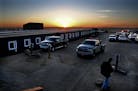 In this 2013 file photo, the sun rose over a man camp in Williston, N.D.