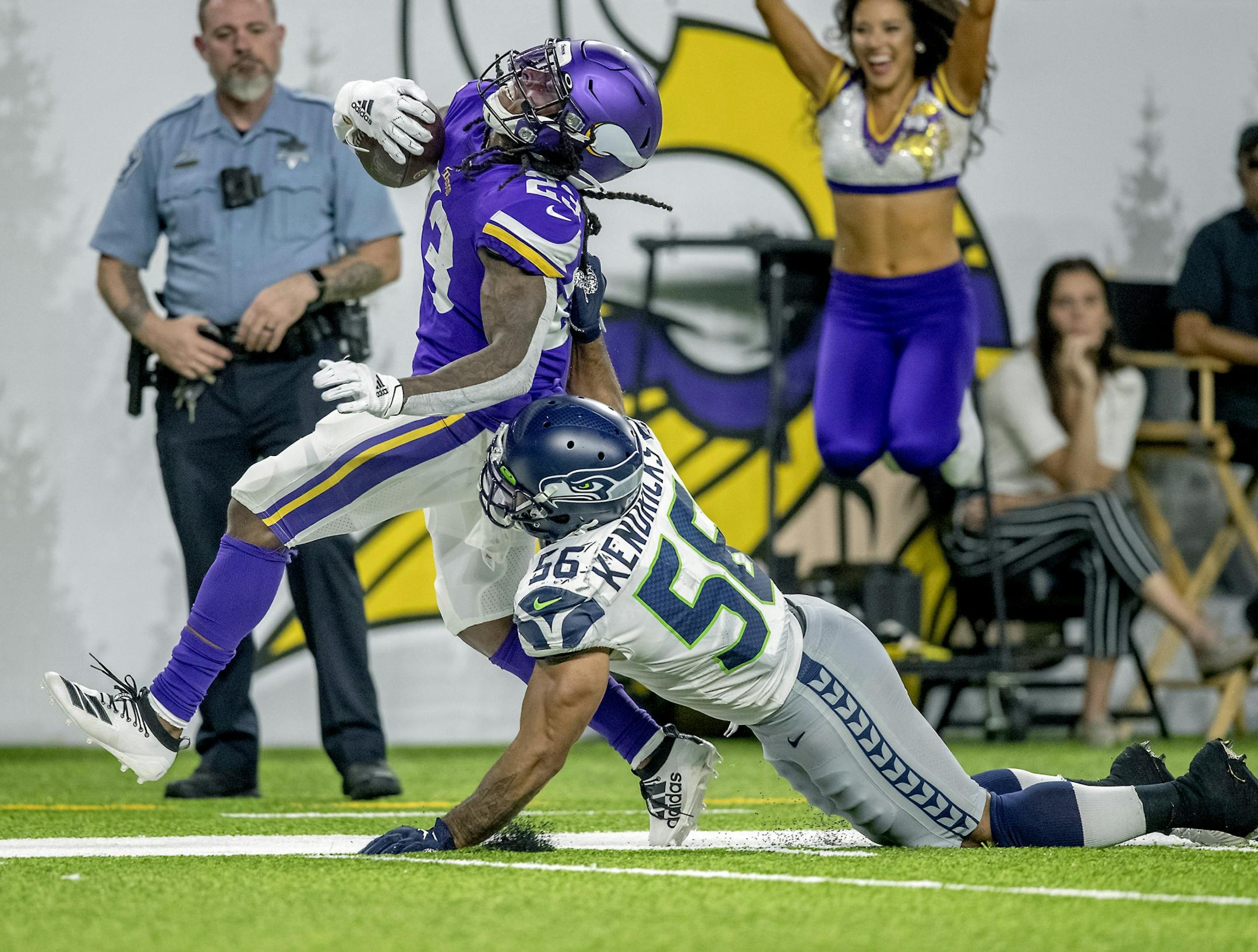 Vikings running back Mike Boone ran for 45 yards before being stopped by Seahawks' linebacker Mychal Kendricks during the second quarter of the pre-season matchup between the Minnesota Vikings and the Seattle Seahawks at US Bank Stadium, Sunday, August 18, 2019 in Minneapolis, MN.