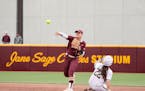 Gophers shortstop Brandt Carlie threw to first as Michigan's Julia Jimenez (22) slid into second base during Game 2 of a doubleheader at Jane Sage Cow