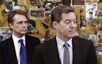FILE - In this March 9, 2017 file photo, Kansas Gov. Sam Brownback, right, along with Lt. Gov. Jeff Colyer participates in a humanitarian award ceremo