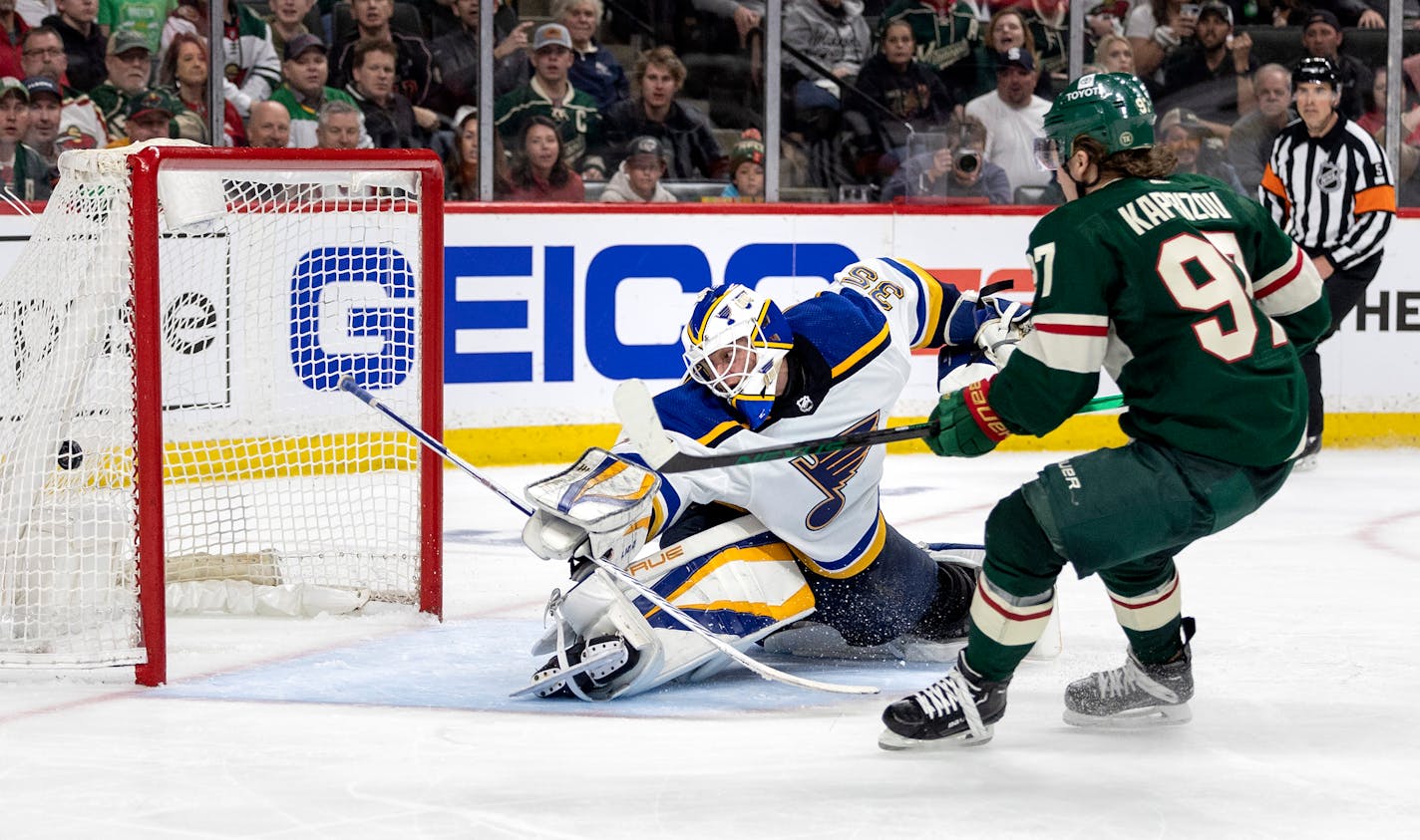 Kirill Kaprizov (97) of the Minnesota Wild gets the puck past St. Louis Blues goalie Ville Husso for a goal in the third period Tuesday, May 4, at Xcel Energy Center in St. Paul, Minn. Game 2 of the NHL playoffs Minnesota Wild vs. St. Louis Blues. ] CARLOS GONZALEZ • carlos.gonzalez@startribune.com