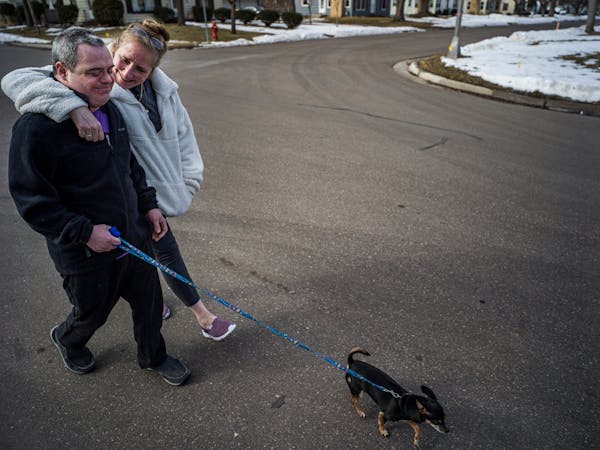 Heidi Randolph and her son, Sam Corbett, who has Down syndrome, walk around their neighborhood Wednesday, after they returned from an 8-hour trip to N