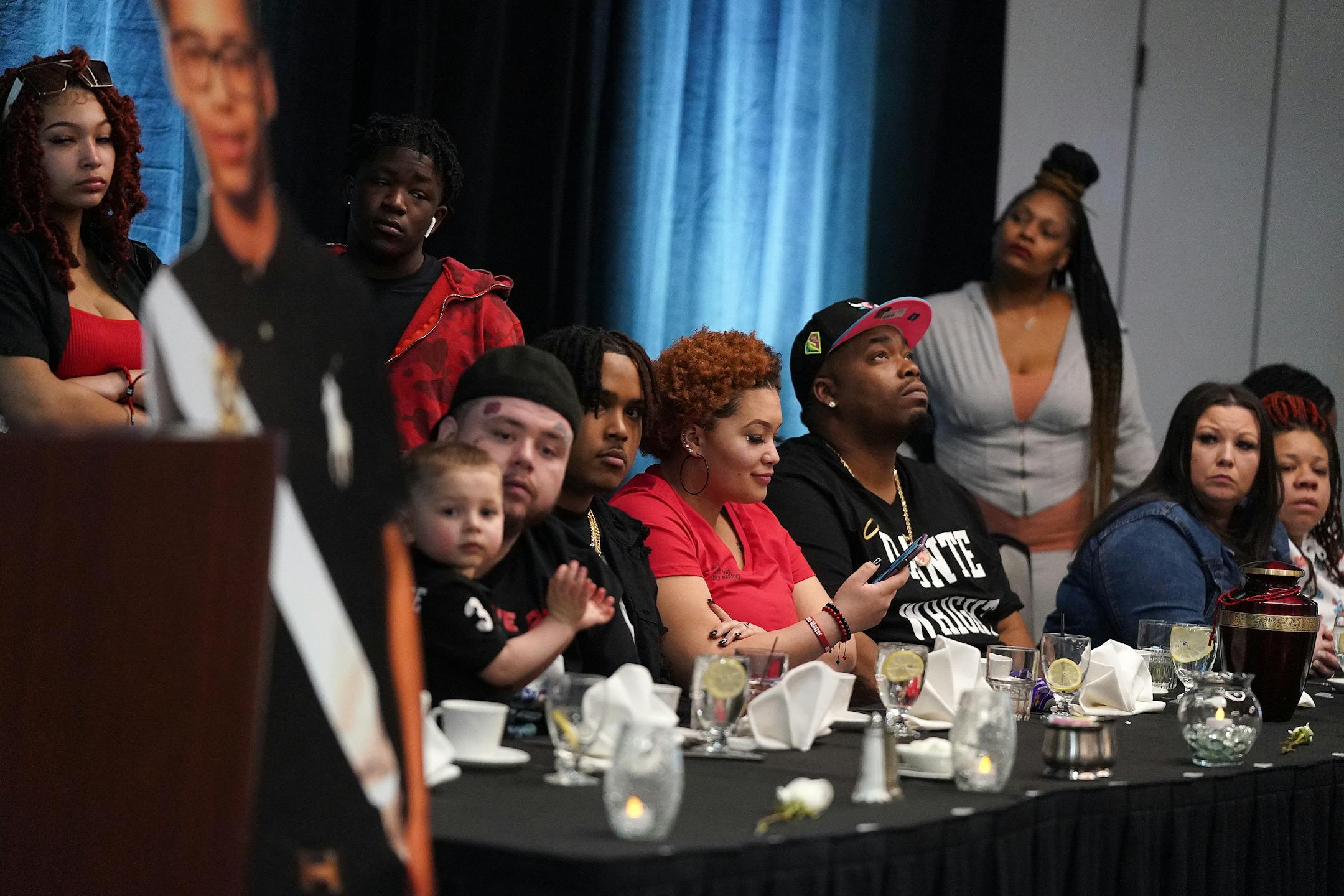 Daunte Wright's family including his father Aubrey Wright and mother Katie Wright listen as Brooklyn Center Mayor Mike Elliott speaks.