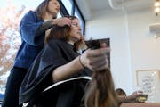 For years, Marti Estey has donated her long, thick hair to charities that make hair pieces for those suffering from hair loss. Here, bangbang Salon st