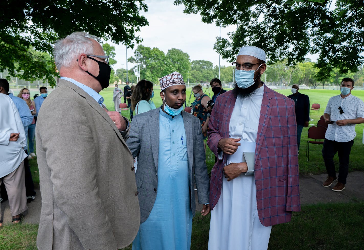 Gov. Tim Walz spoke with Imam Mohamed Mukhtar after his public remarks. ] MARK VANCLEAVE - Faith and elected leaders denounced anti-Muslim violence in response to an attack on Sheikh Mohamed Mukhtar at the Dar Al-Farooq Islamic Center on Friday, Aug. 14, 2020 in Bloomington. The imam was attacked Aug. 6 while on his way to the mosque for evening prayers.