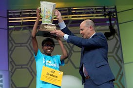 Bruhat Soma, 12, of Tampa, Fla., holds the trophy after winning the Scripps National Spelling Bee, in Oxon Hill, Md., Thursday, May 30, 2024. (AP Phot