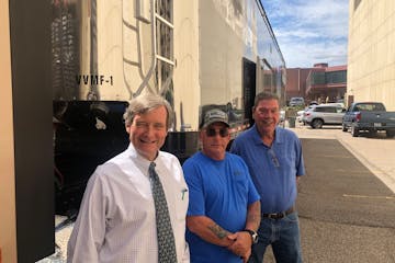 President Brian Short of Short Companies, owner of Admiral Merchants trucking; truck driver-owner Doron Doravi, and Admiral Merchants manager Tim Burk