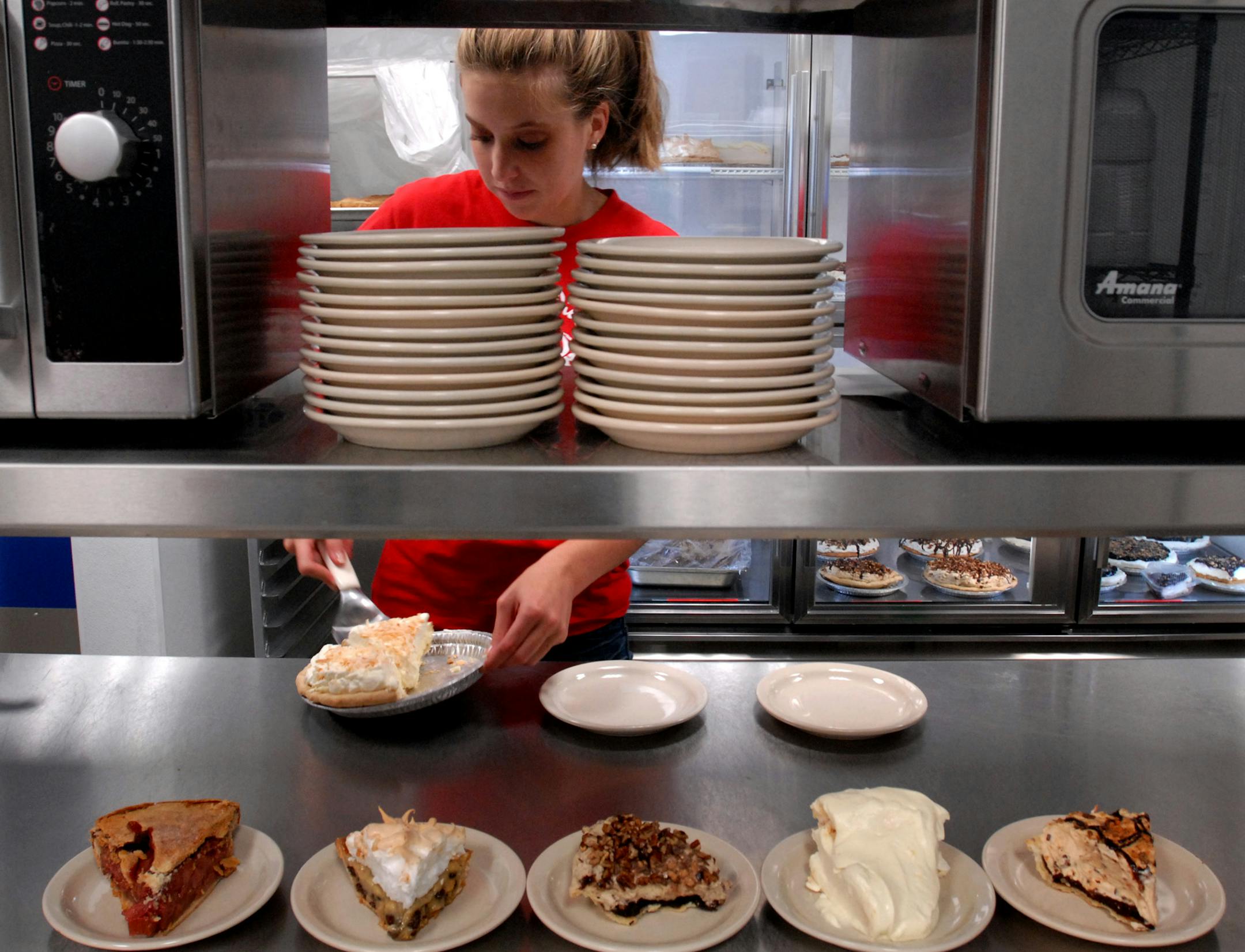 Katie Erickson was busy cutting slices of pie at Betty's Pies pie-cutting station in the kitchen.
