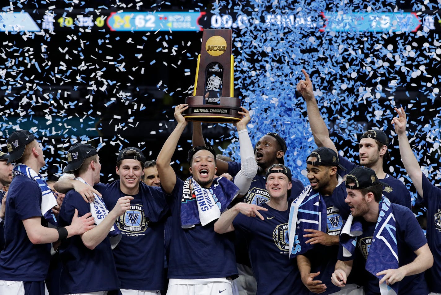 Villanova players celebrate with the trophy after beating Michigan 79-62 in the championship game of the Final Four NCAA college basketball tournament, Monday, April 2, 2018, in San Antonio. (AP Photo/David J. Phillip)