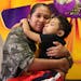 Julian Morales, 7, hugs his mom Mayra Garcia in their Homestead, Fla. home on Wednesday evening, Sept. 26, 2018. Julian has a very rare genetic disord