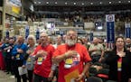 Delegates recite the Pledge of Allegiance at the start of the convention.