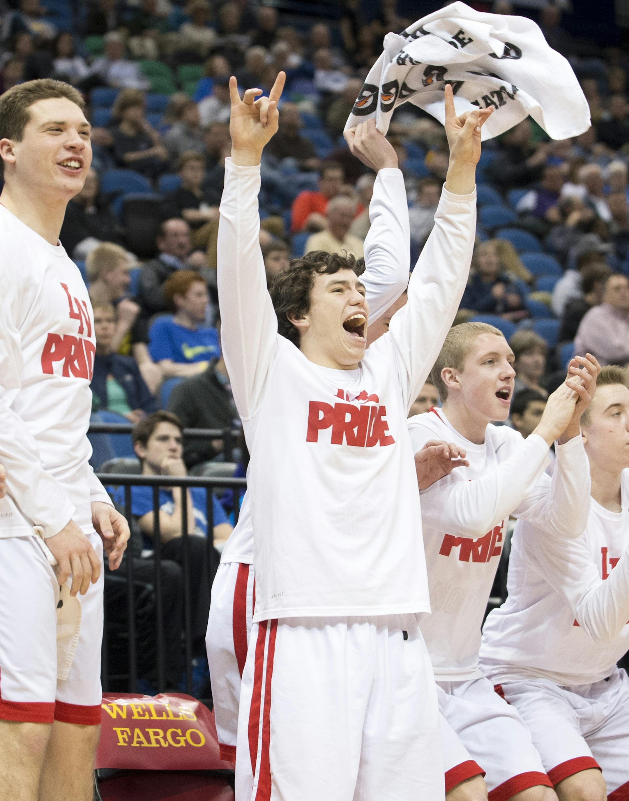 The Lakeville North bench erupts in the second half as they extend their lead over Hopkins into the double digits. ] (Aaron Lavinsky | StarTribune) Lakeville North plays Hopkins in the Class 4A boys' basketball quarterfinals on Wednesday, March 11, 2015 at Target Center.