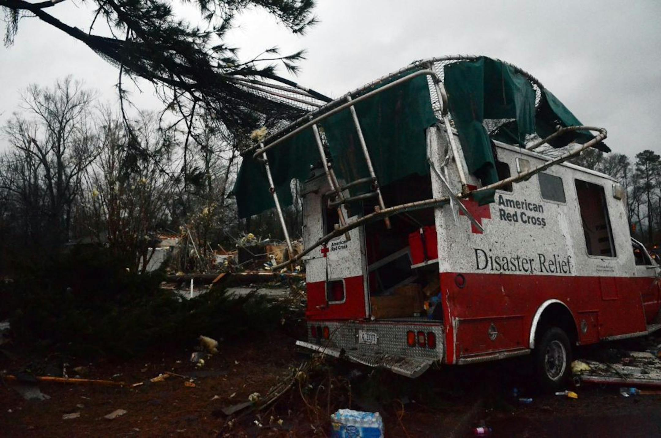 A trampoline rests on top of a damaged American Red Cross disaster relief truck outside of the Hattiesburg American Red Cross center which was completely destroyed by an apparent tornado that moved through Hattiesburg, Miss., Sunday, Feb. 10, 2013.
