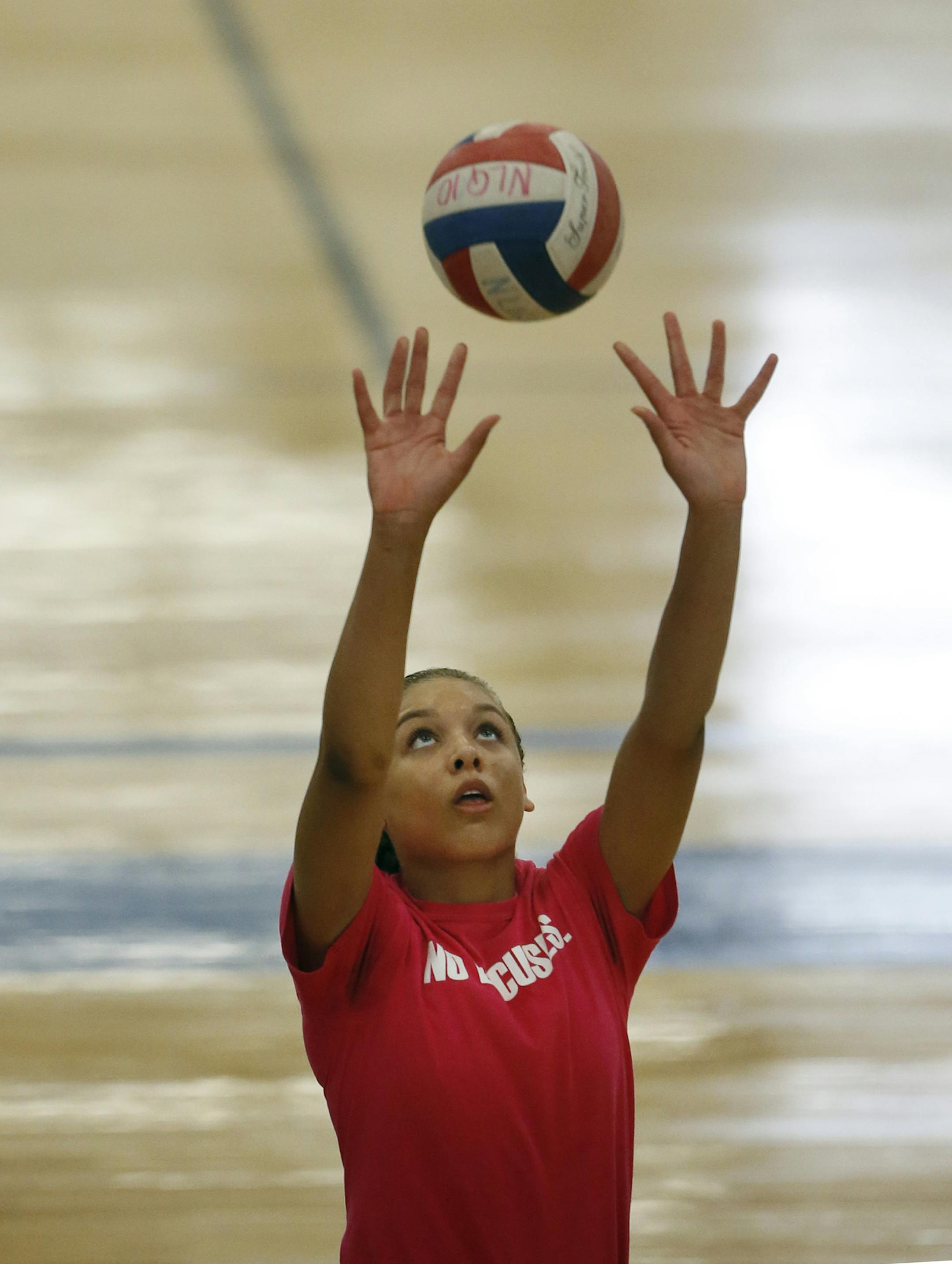 Jasmyn Matin worked on serving during the first day of Hopkins High volley ball practice , Monday Aug 12 ,2013 in Hopkins, MN. ] JERRY HOLT ‚Ä¢ jerry.holt@startribune.com