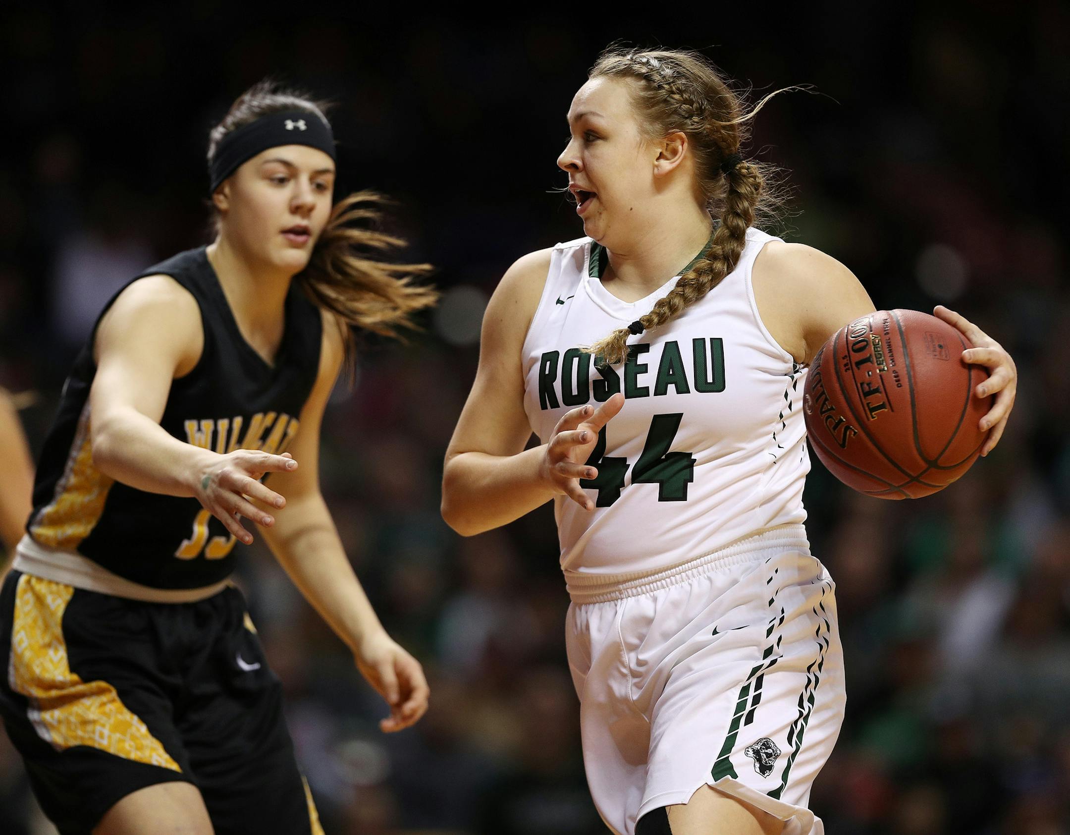 Roseau's Kiley Borowicz (44) dribbled the ball around New London-Spicer's Shea Oman (13) in the first half. ] ANTHONY SOUFFLE ï anthony.souffle@startribune.com Players competed during the girls' basketball state tournament Class 2A semifinal games Friday, March 17, 2017 at Williams Arena on the grounds of the University of Minnesota in Minneapolis.