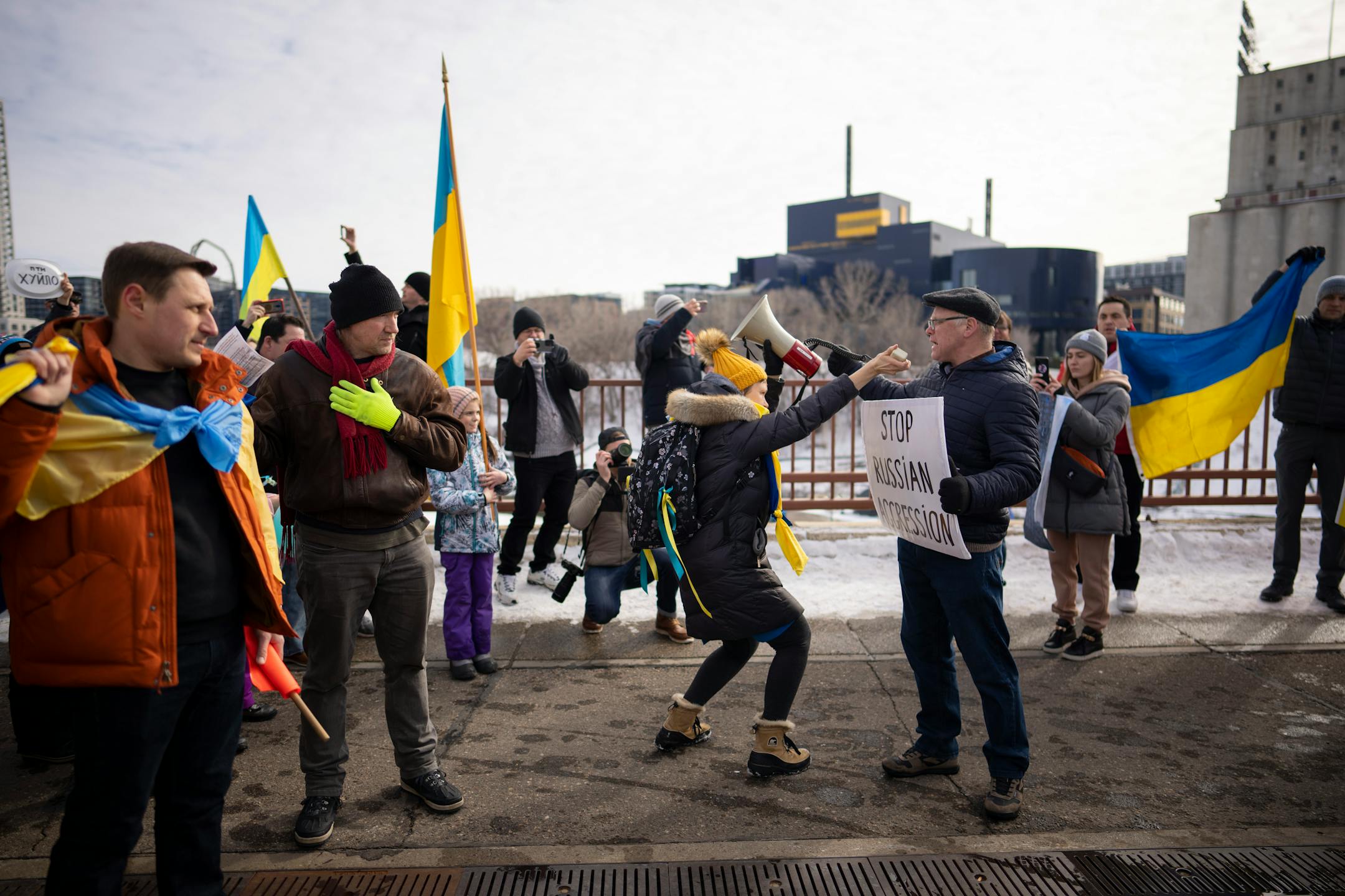 Ukraine supporters met with a delegation of Belarusians on the Stone Arch Bridge who voiced support for Ukraine Sunday afternoon, February 27, 2022 in Minneapolis, Minn. Hundreds of supporters of the people of Ukraine met a few dozen supporters of the Belarusian people midway across the Stone Arch Bridge in Minneapolis before continuing on a march together across the Hennepin Ave. bridge to Northeast Minneapolis where the march first began. ] JEFF WHEELER • Jeff.Wheeler@startribune.com