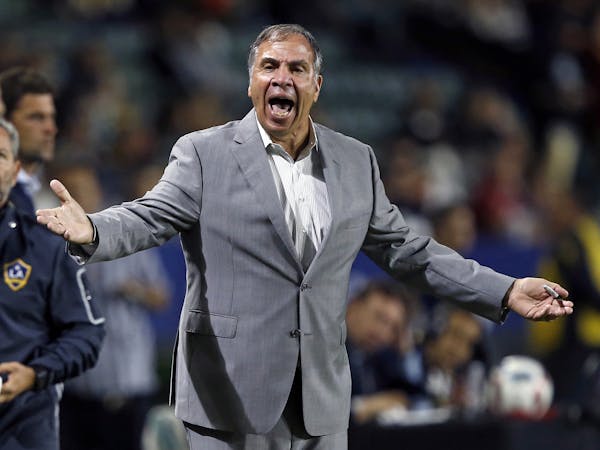 FILE - In this Oct. 26, 2016, file photo, Los Angeles Galaxy head coach Bruce Arena yells at the side judge during the first half of a knockout round 