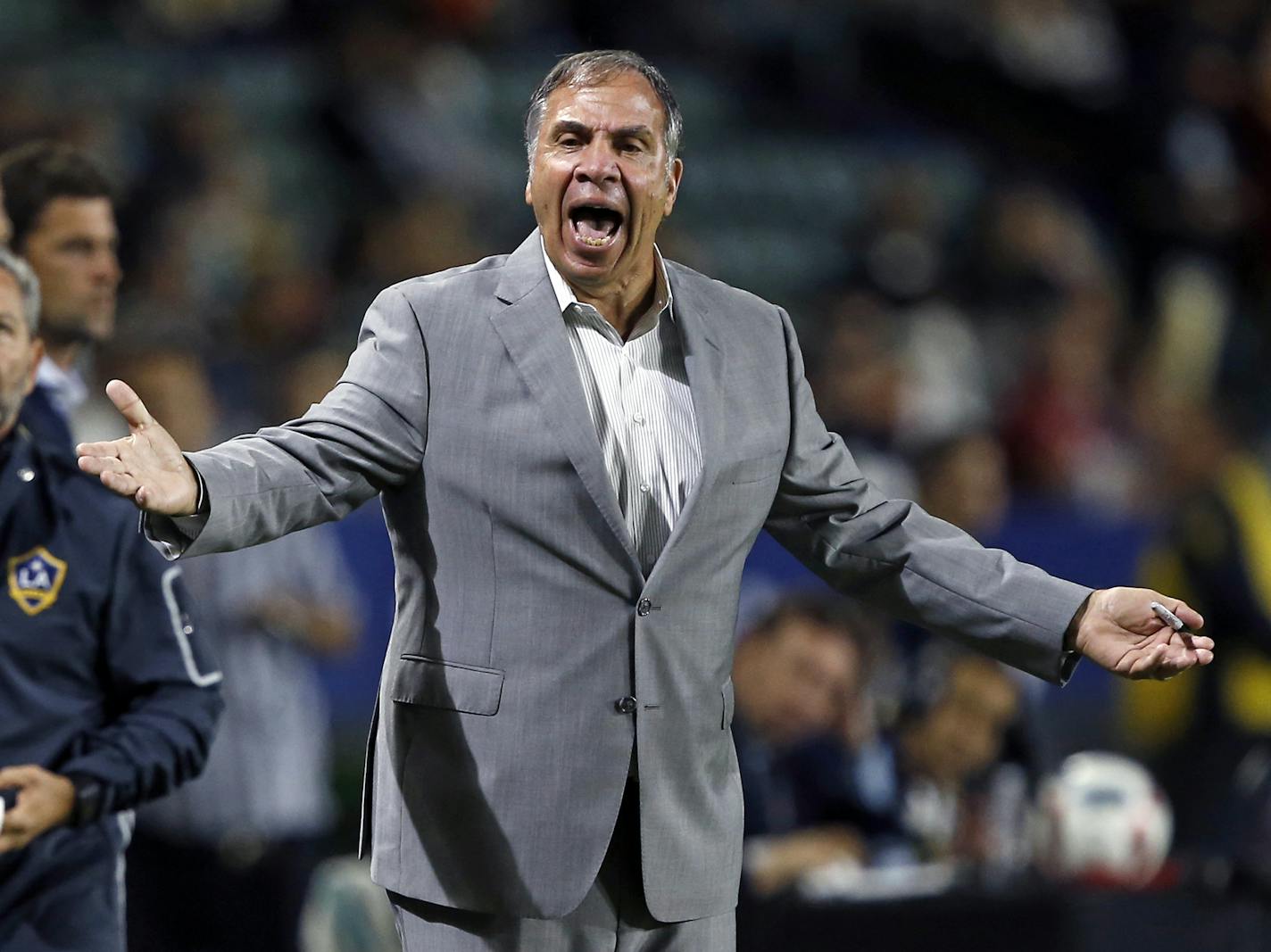 FILE - In this Oct. 26, 2016, file photo, Los Angeles Galaxy head coach Bruce Arena yells at the side judge during the first half of a knockout round MLS playoff soccer match against Real Salt Lake in Carson, Calif. Arena is returning to coach the U.S. national team, a decade after he was fired. The winningest coach in American national team history, Arena took over Tuesday, Nov. 22, 2016, one day after Jurgen Klinsmann was fired. (AP Photo/Alex Gallardo, FIle) ORG XMIT: MIN2016112218471146