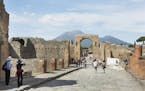 The archaeological site of Pompeii, with Mount Vesuvius in the background, in Italy, Sept. 29, 2015. Using a CT scanner, a team of researchers hopes t