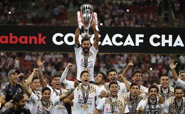 Chivas players held the trophy aloft as they celebrated winning the CONCACAF Champions League final soccer match in Guadalajara, Mexico on April, 25, 