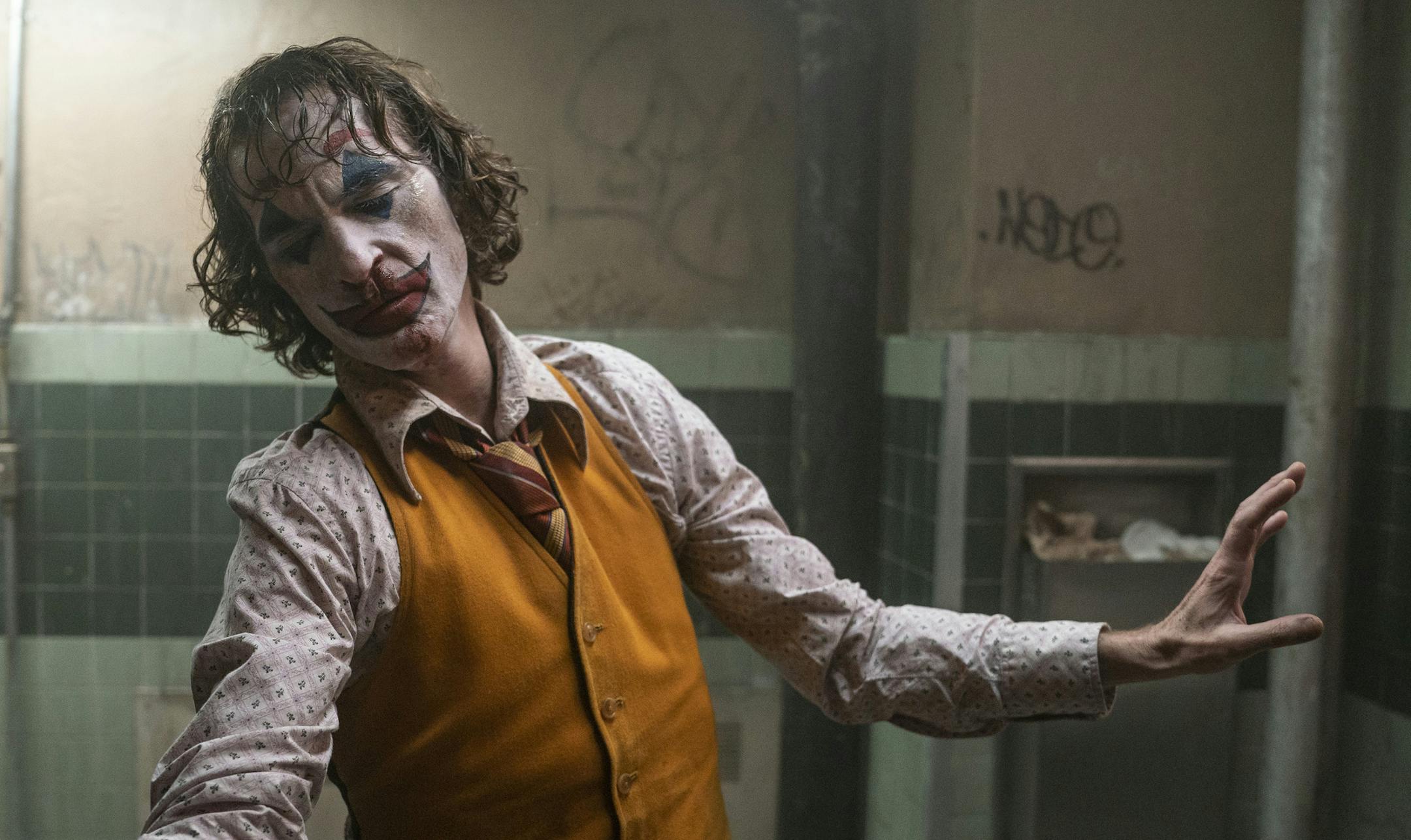 This image released by Warner Bros. Pictures shows Joaquin Phoenix in a scene from "Joker." On Monday, Jan. 13, the film was nominated for an Oscar for best picture. (Niko Tavernise/Warner Bros. Pictures via AP)