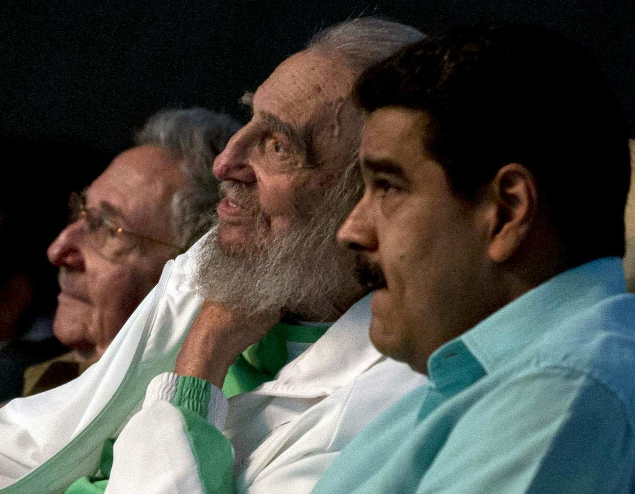 Cuban Leader Fidel Castro, center, attends a gala for his 90th birthday accompanied by Cuba's President Raul Castro, left, and Venezuela's President Nicolas Maduro, right, at the 'Karl Marx' theater in Havana, Cuba, Saturday, Aug. 13, 2016. (Ismael Francisco, Cubadebate via AP)