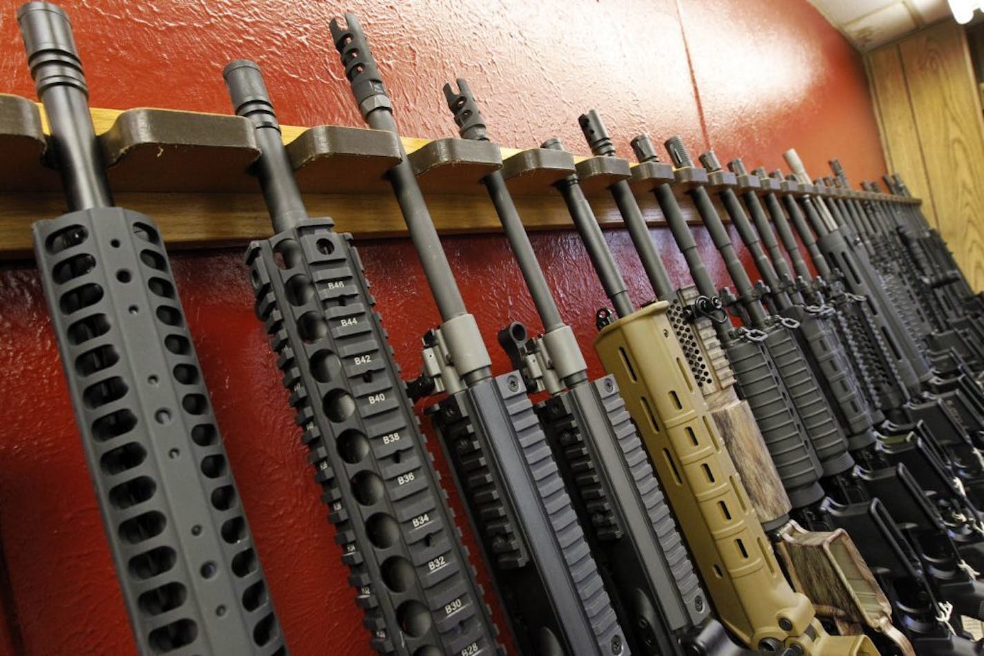 FILE - In this July 20, 2012, file photo, a row of different AR-15 style rifles are displayed for sale at the Firing-Line indoor range and gun shop in Aurora, Colo. After a steady string of mass shootings and a revival of the political fight over gun control, Americans are slightly more likely than they were two years ago, in 2013, to say gun laws should be made stricter, a new Associated Press-GfK poll found.