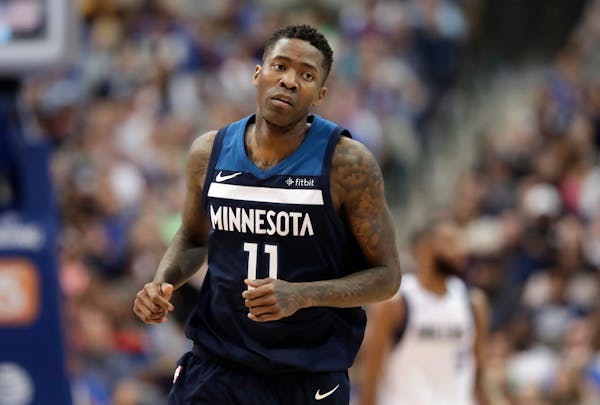 Minnesota Timberwolves' Jamal Crawford (11) jogs to the bench during an NBA basketball game against the Dallas Mavericks in Dallas, Friday, March 30, 